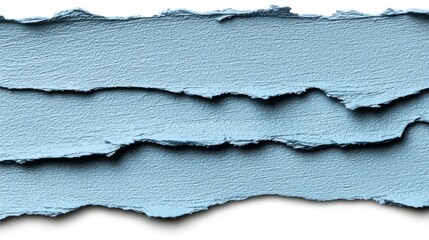 A torn piece of blue paper with rough edges and a shadow.