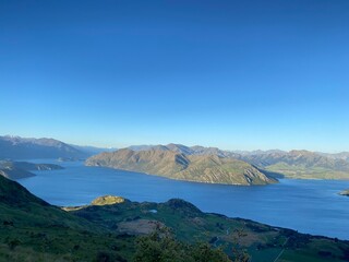 Beautiful landscapes of Lake Wanaka from Mount Roy, Roys Peak, Wanaka, South Island, New Zealand. Landscape with mountains and sky