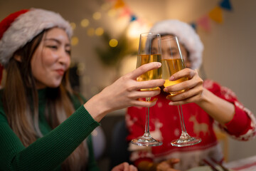 Two Asian women in room with Ciematic lighting celebrate important events such birthdays Christmas