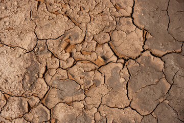 Looking Down At Cracked Dirt Drying In The Sun