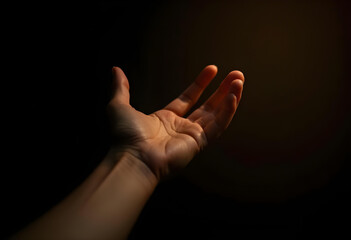 Obraz premium hand reaching out in soft light, symbolizing hope and connection. image captures delicate textures and natural tones of skin