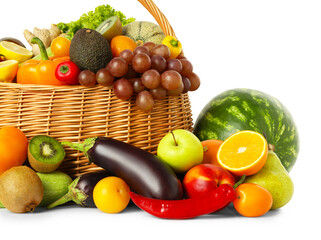 Many different fruits and vegetables in wicker basket isolated on white