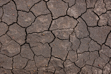 Wall texture soil dry crack pattern of drought lack of water of nature brown old broken background.