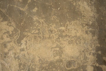 Old cement wall rusted by the weather, texture. Old yellow concrete wall with cracks. Background.