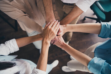 Close up cropped photo of confident cheerful people putting palms together motivation startup...