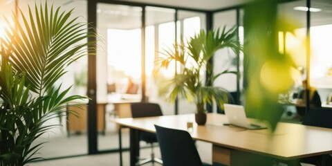 Fototapeta premium Modern office interior, sunlit workspace, glass walls, palm leaves in foreground, minimalist furniture, warm ambient lighting, clean aesthetic, open plan design, contemporary workplace, natural elemen
