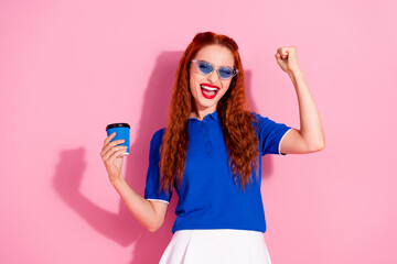 Photo of cheerful positive glad woman wear blue trendy clothes hold cup drink beverage isolated on pink color background