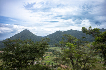 Beautiful green valley with mountains, showcasing peaceful scenery and natural surroundings.