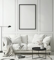 Minimalist living room interior with a white sofa. black coffee table. and a framed artwork on the wall