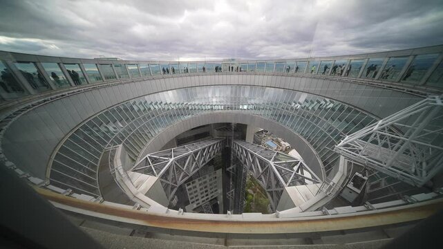 Futuristic glass building in Japan, Osaka business financial district. Umeda Sky Building tourist attraction in Osaka. Host city of Expo 2025. 