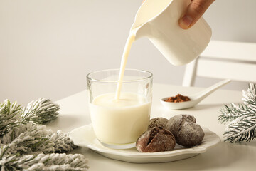 Delicious Grinkle cookies in a plate, with milk, on a light background.