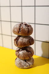 Appetizing Grinkle cookies on a yellow background.