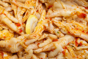 Sweet and Sour Chicken Feet with spicy seasoning.