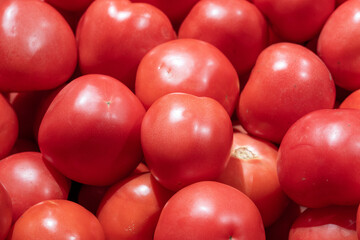 fresh ripe red tomatoes in market.