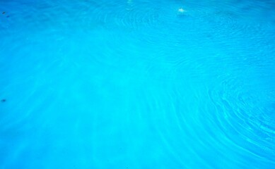 photo of clear and blue swimming pool water, suitable for your background