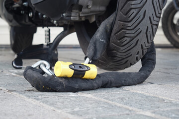 This is a secure motorcycle lock that features a heavyduty chain combined with a padlock