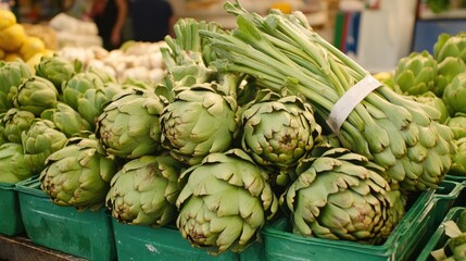 Fototapeta premium Fresh artichokes in a market stall. A perfect image for recipes, articles, or any content related to healthy eating and Mediterranean cuisine.