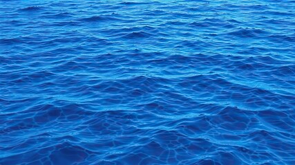 Obraz premium Blue abstract water texture with ripples and reflections, blue, design, background