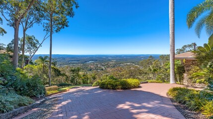 Obraz premium Scenic view from a hillside overlooking a lush landscape and distant horizon.
