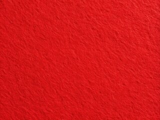 Fototapeta premium Vibrant red matte felt texture perfect for seasonal decorations, three-dimensional art projects, and retro-style wrapping, adding a unique touch to your creative endeavors.