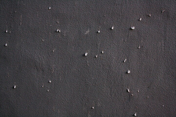 Water droplets on grey wall