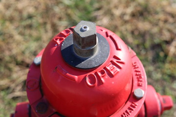 Top of red metal fire hydrant close-up