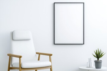 Modern minimalist interior featuring a white armchair, empty black frame, and potted plant on a side table.