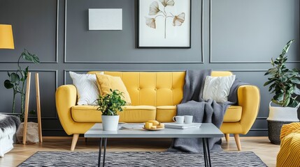 A modern living room featuring gray walls, a mustard yellow sofa, and white decor elements
