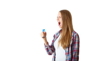 Woman in plaid shirt yelling with a blue megaphone, isolated on a white background. Concept of communication and expression