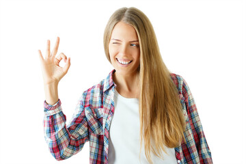 Smiling woman winking and making an OK gesture, wearing a plaid shirt, isolated on white...