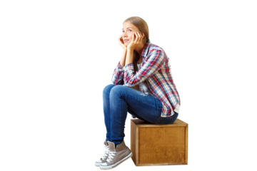 Woman in casual attire sitting on a wooden box, isolated on white. Represents contemplation and casual style