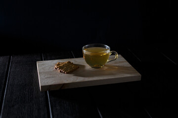 Tea still life. A cup of hot tea and cookies. Table for tea drinking.