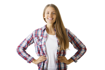 Young woman smiling in a plaid shirt, hands on hips, on a white background. Portrait of confidence and positivity