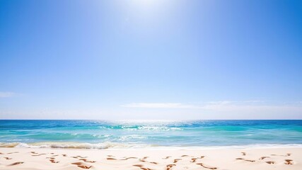 Fototapeta premium Sandy beach with footprints leading towards calm ocean under clear blue sky, footprints, scenic, beauty