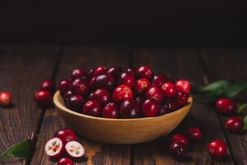 Cranberry berries in a wooden plate