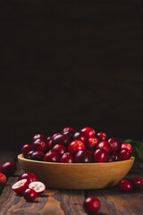 Cranberry berries in a wooden plate