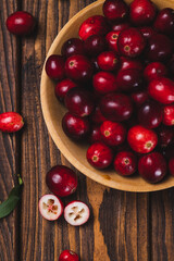 Cranberry berries in a wooden plate