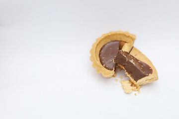 Tart chocolate isolated on white, selective focus on subject