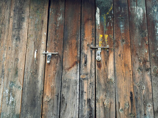 The door is made of wood and has a metal latch