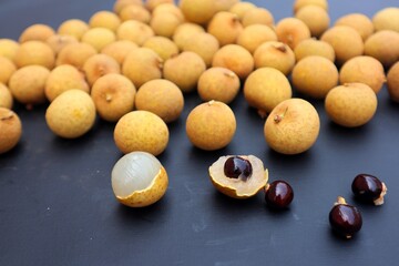 Longan fruit or Dimocarpus longan, on a dark background, with close view.