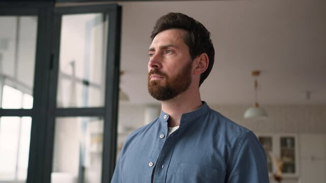 Thoughtful Caucasian man bearded guy middle-aged dad pondering at home. Pensive parent contemplating adult male father thinking with serious facial expression confident businessman feel calm dreaming