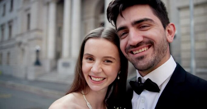 Kiss, wedding and face of couple in city with commitment, happiness and love for romantic event. Smile, connection and portrait of bride and groom fro Canada at court for marriage ceremony in town.