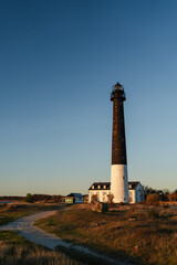 Pathway leading to S&otilde;rve lighthouse at sunset