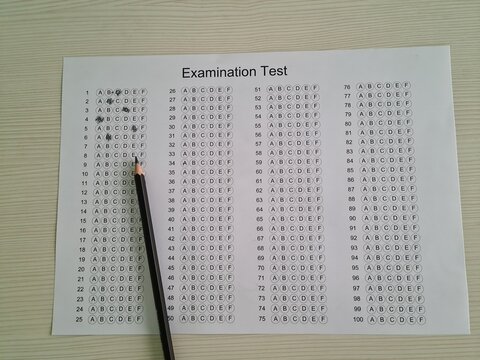 Examination test answer sheet with multiple-choice options arranged in rows and columns on a plain surface