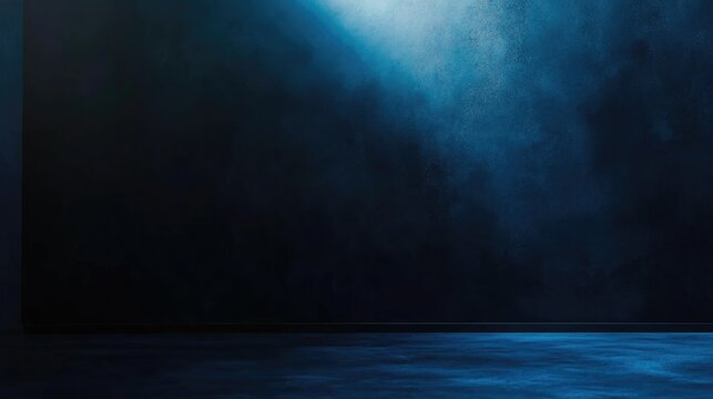 Deep black wall illuminated by a light source creating a striking contrast with a dark blue backdrop