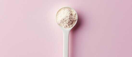 Collagen Protein Powder In Spoon On Pink Background Natural Beauty And Health Supplement For Skin Bones Joints