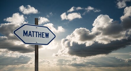 Matthew text on road sign with clouds and sky background