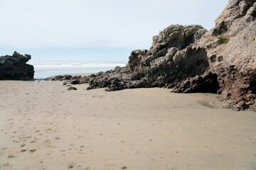 Coastal Rocks at Sumner Beach: Rugged New Zealand Shoreline