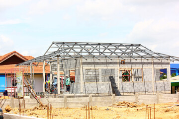 worker working new house under construction site