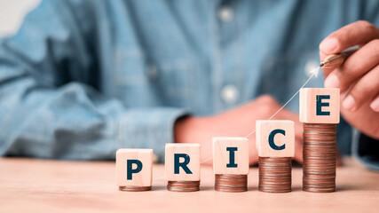 Price symbol. Price concept. Price wording on increasing wooden block on coins stacking for product...